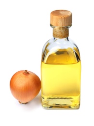 Photo of Glass bottle of onion syrup and fresh ingredient on white background