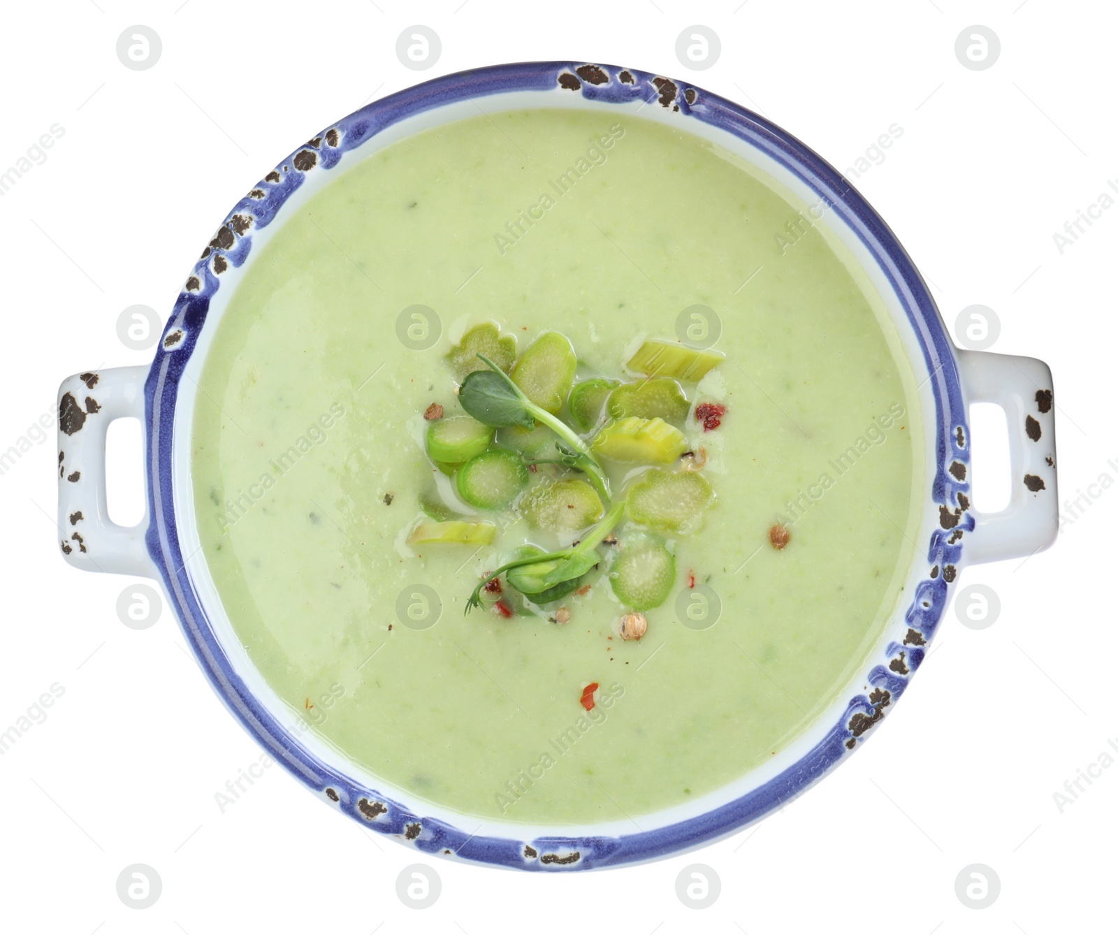 Photo of Delicious asparagus soup in bowl on white background, top view