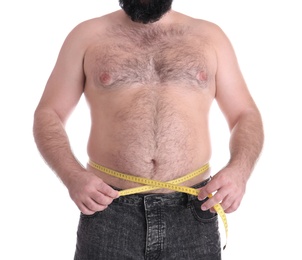 Fat man with measuring tape on white background, closeup. Weight loss