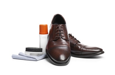 Photo of Stylish men's footwear and shoe care accessories on white background