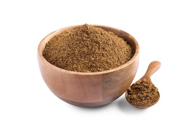 Photo of Bowl and spoon of aromatic caraway (Persian cumin) powder isolated on white