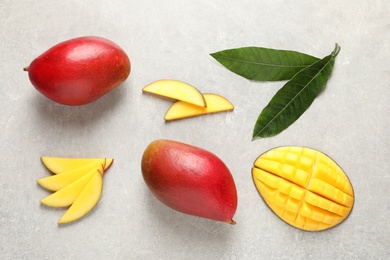 Photo of Flat lay composition with mango on grey background