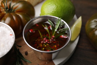 Tasty marinade and products on wooden table, closeup