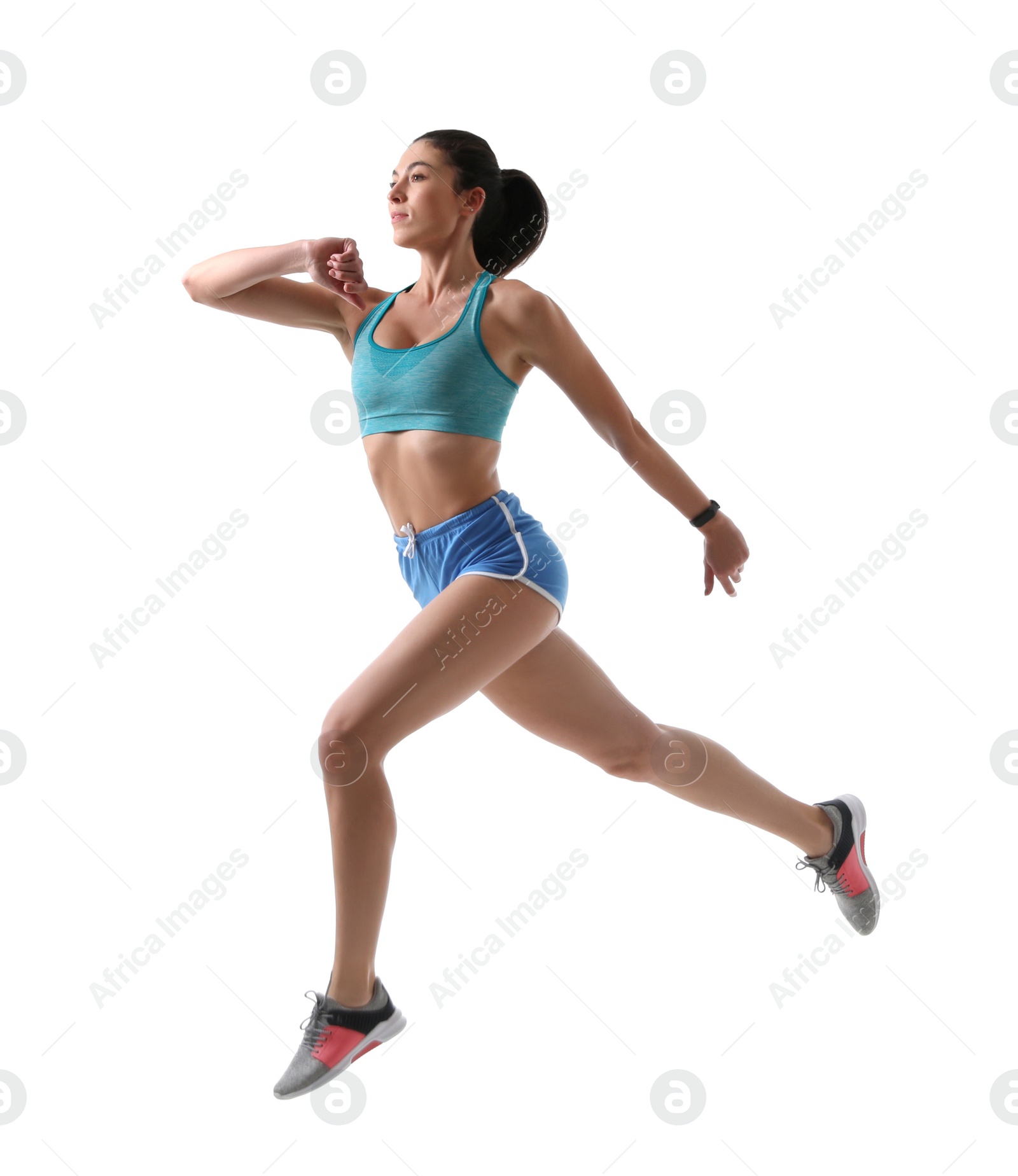 Photo of Athletic young woman running on white background, side view