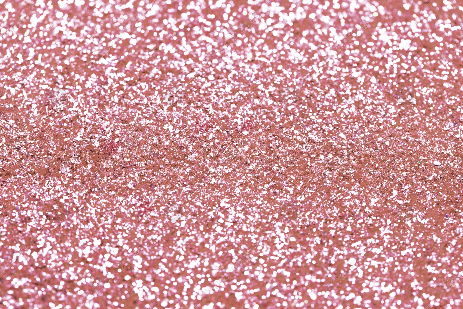 Photo of Beautiful pink shiny glitter as background, closeup