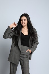 Beautiful woman in formal suit on white background. Business attire