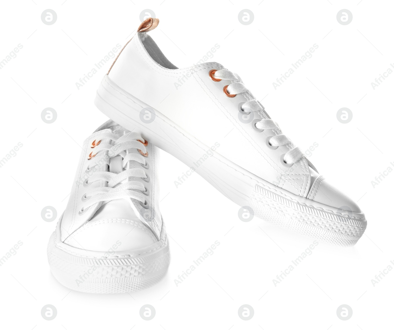 Photo of Pair of casual shoes on white background