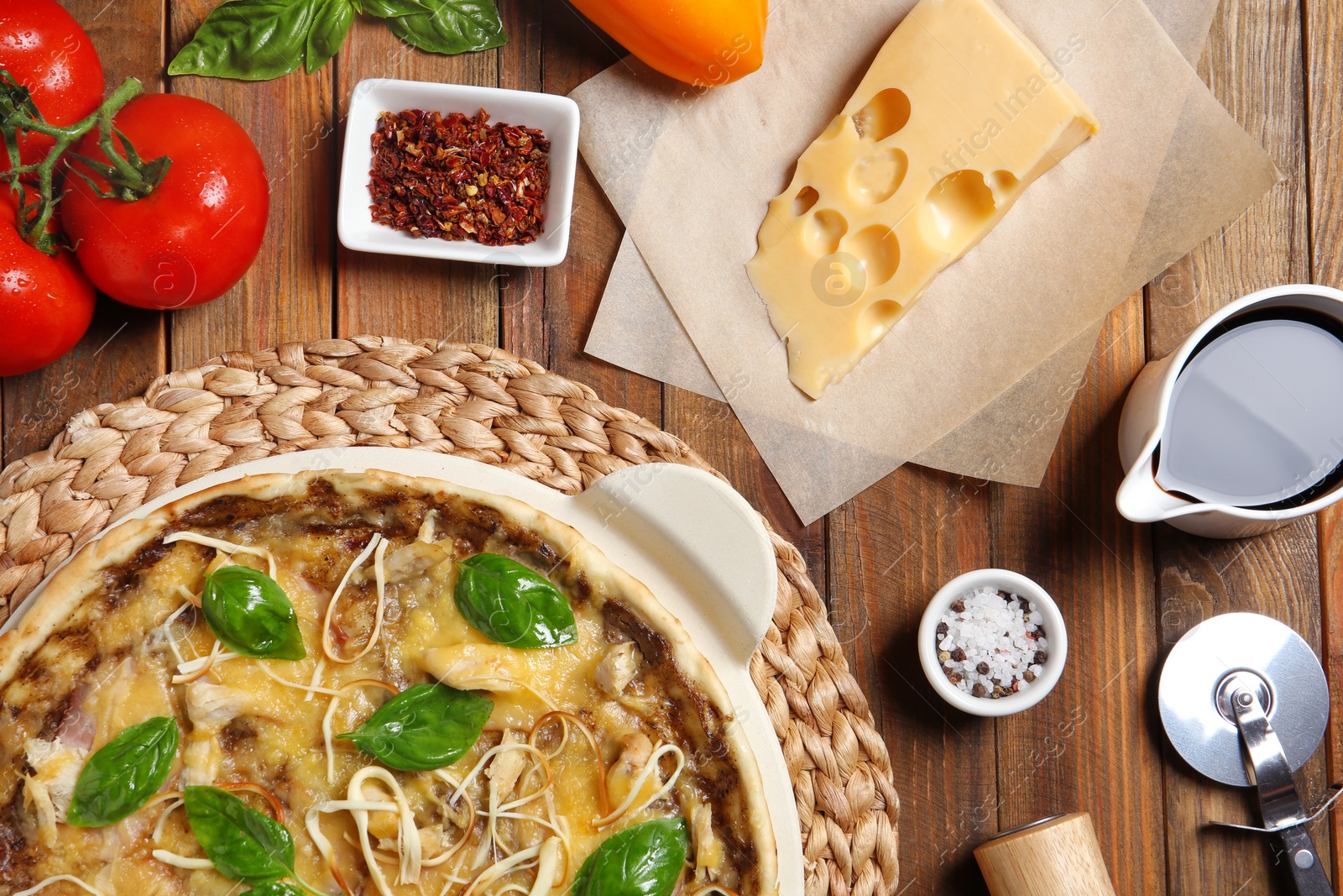 Photo of Flat lay composition with delicious homemade pizza on wooden background