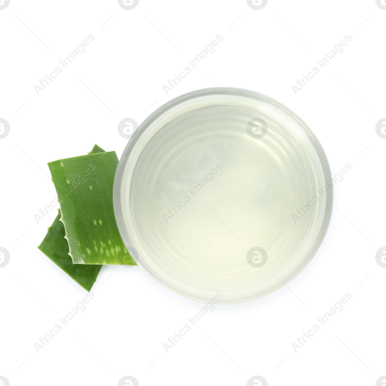 Photo of Fresh aloe drink in glass and leaf slices on white background, top view