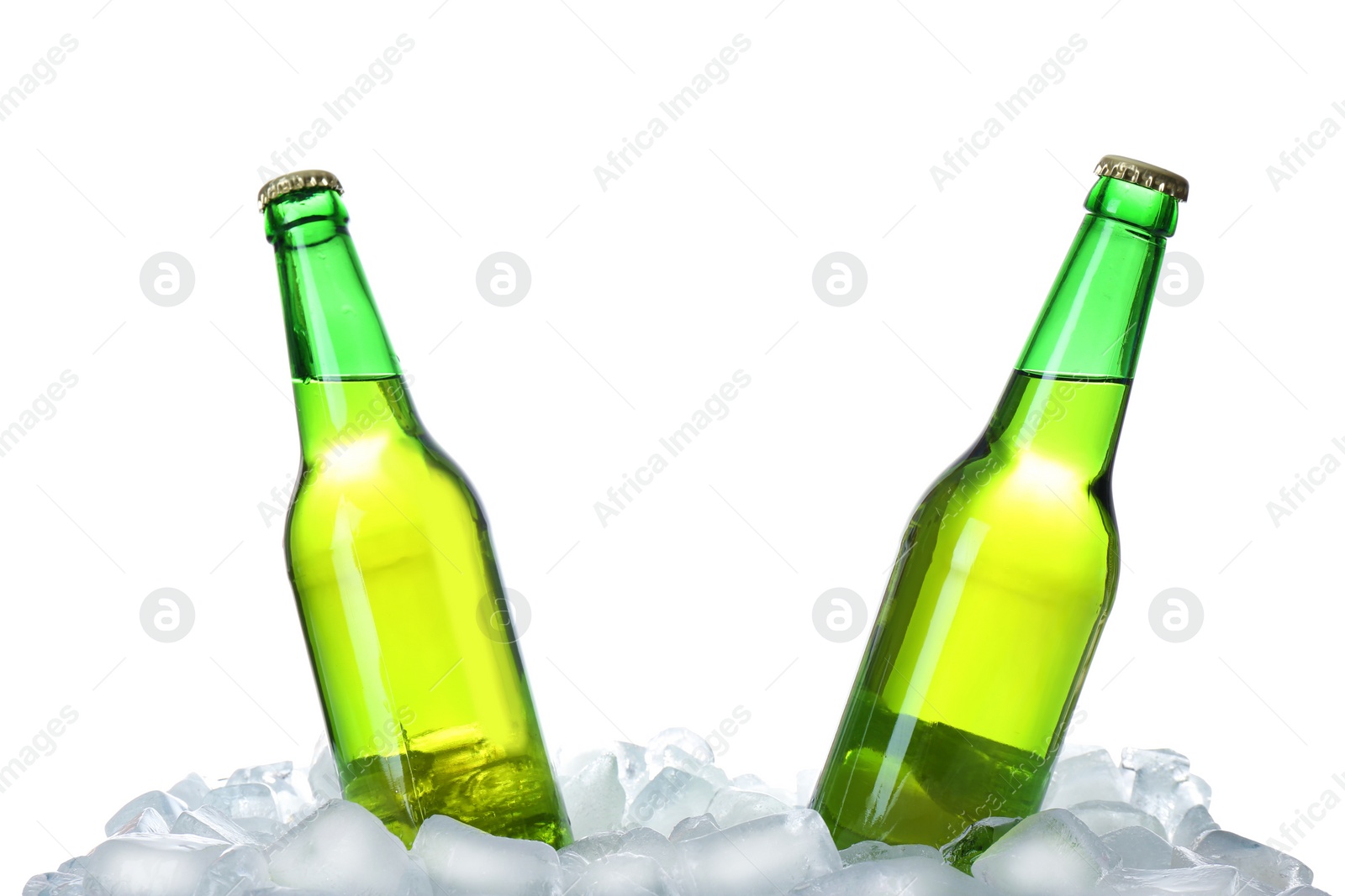 Photo of Bottles of beer on ice cubes against white background