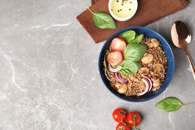 Photo of Flat lay composition with tasty buckwheat porridge marble table, space for text