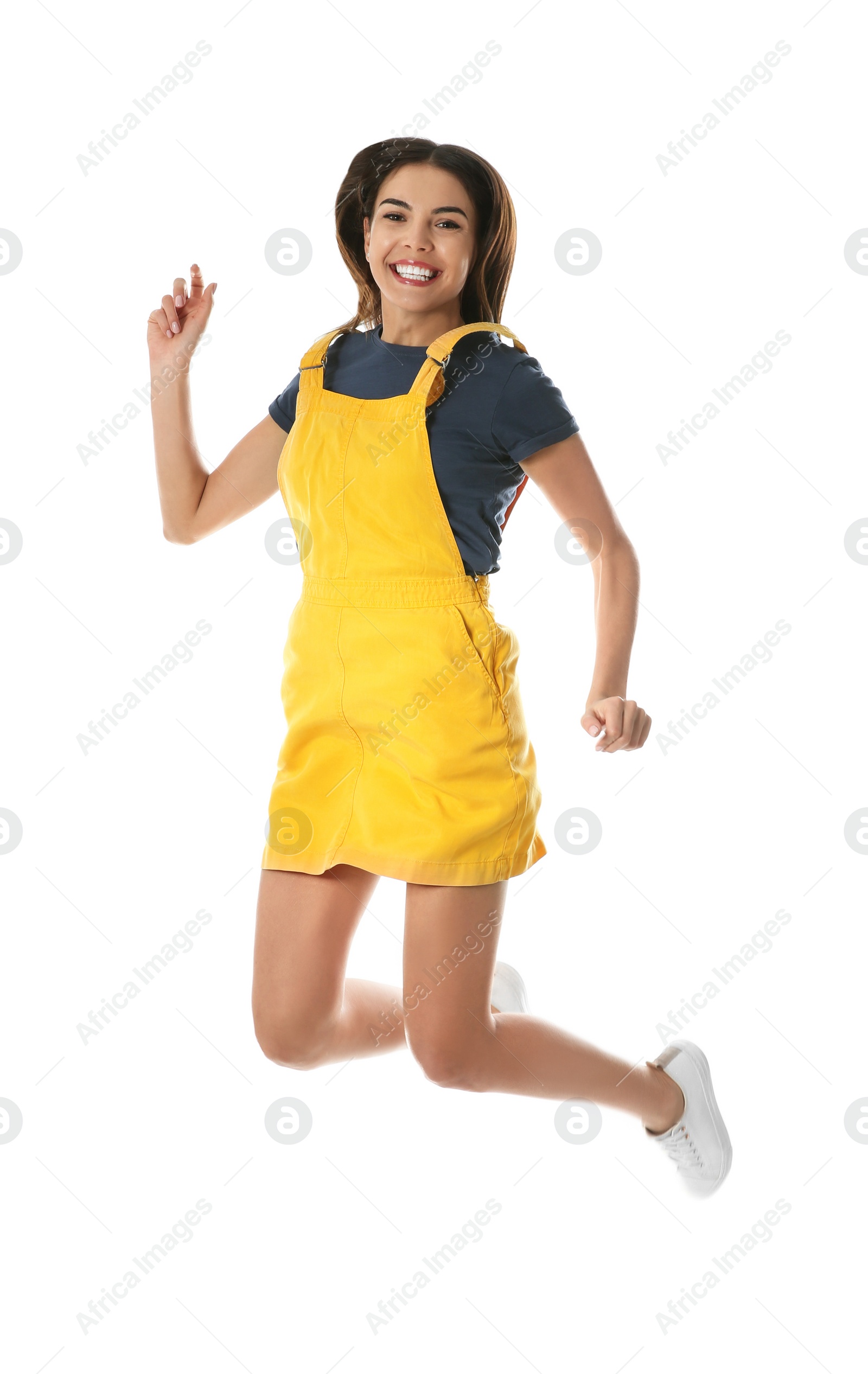 Photo of Full length portrait of pretty woman jumping on white background