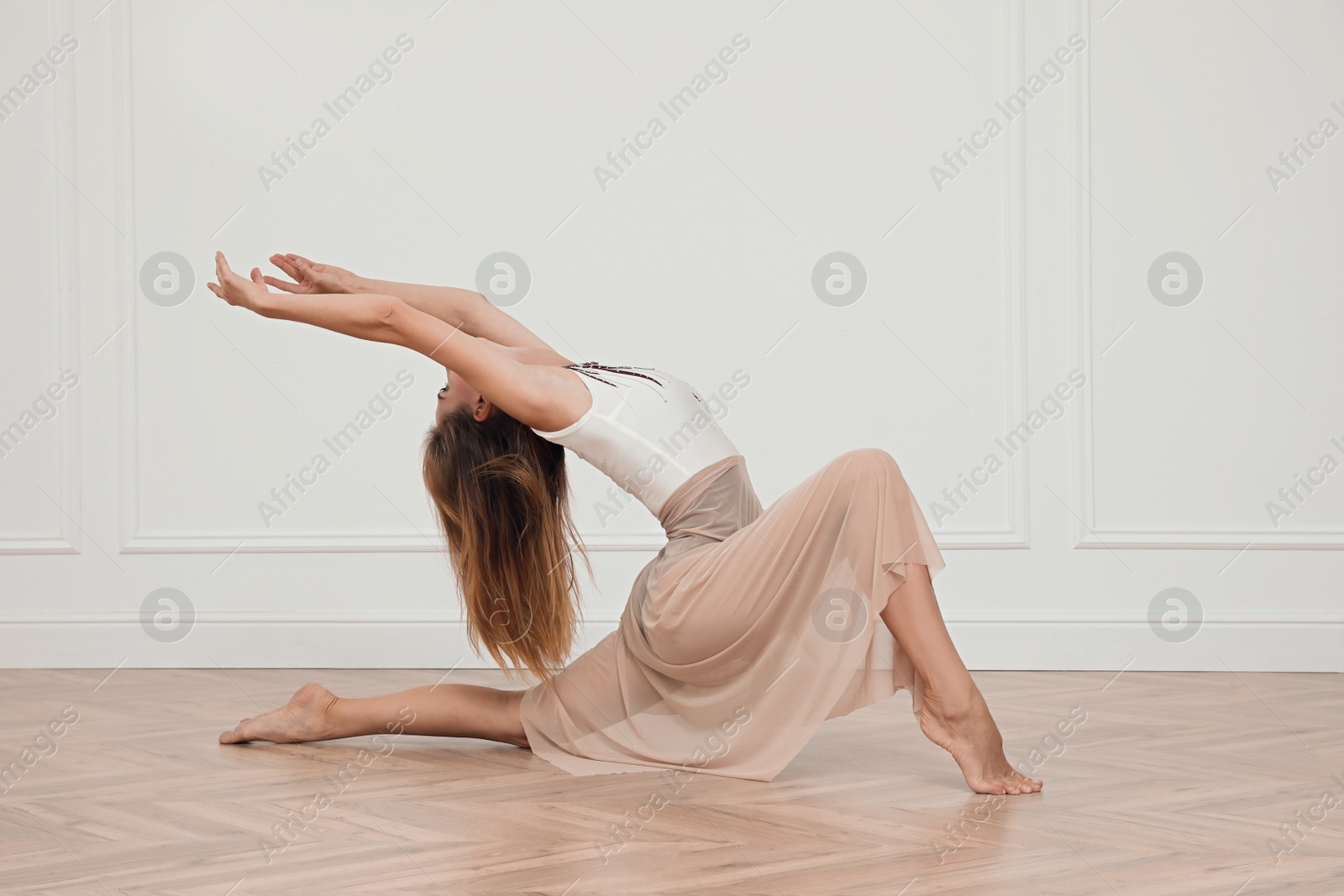 Photo of Beautiful professional dancer practicing moves in studio