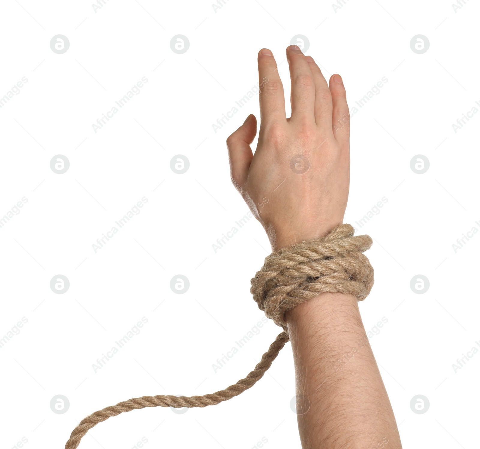 Photo of Freedom concept. Man with tied rope on his hand against white background, closeup