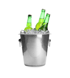 Photo of Metal bucket with bottles of beer and ice cubes isolated on white