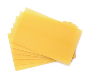 Stack of uncooked lasagna sheets isolated on white, top view