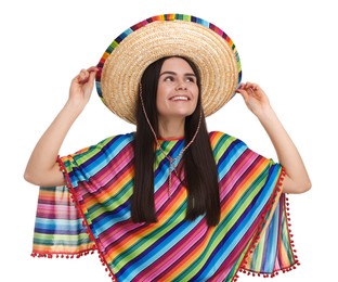 Young woman in Mexican sombrero hat and poncho on white background