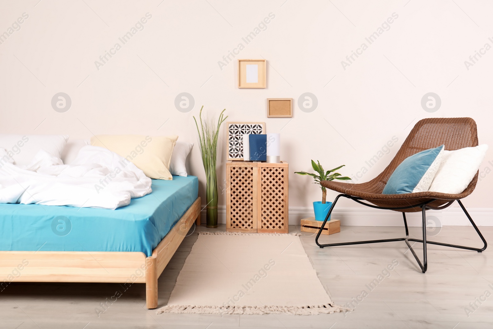 Photo of Modern bedroom interior with comfortable chair. Stylish design