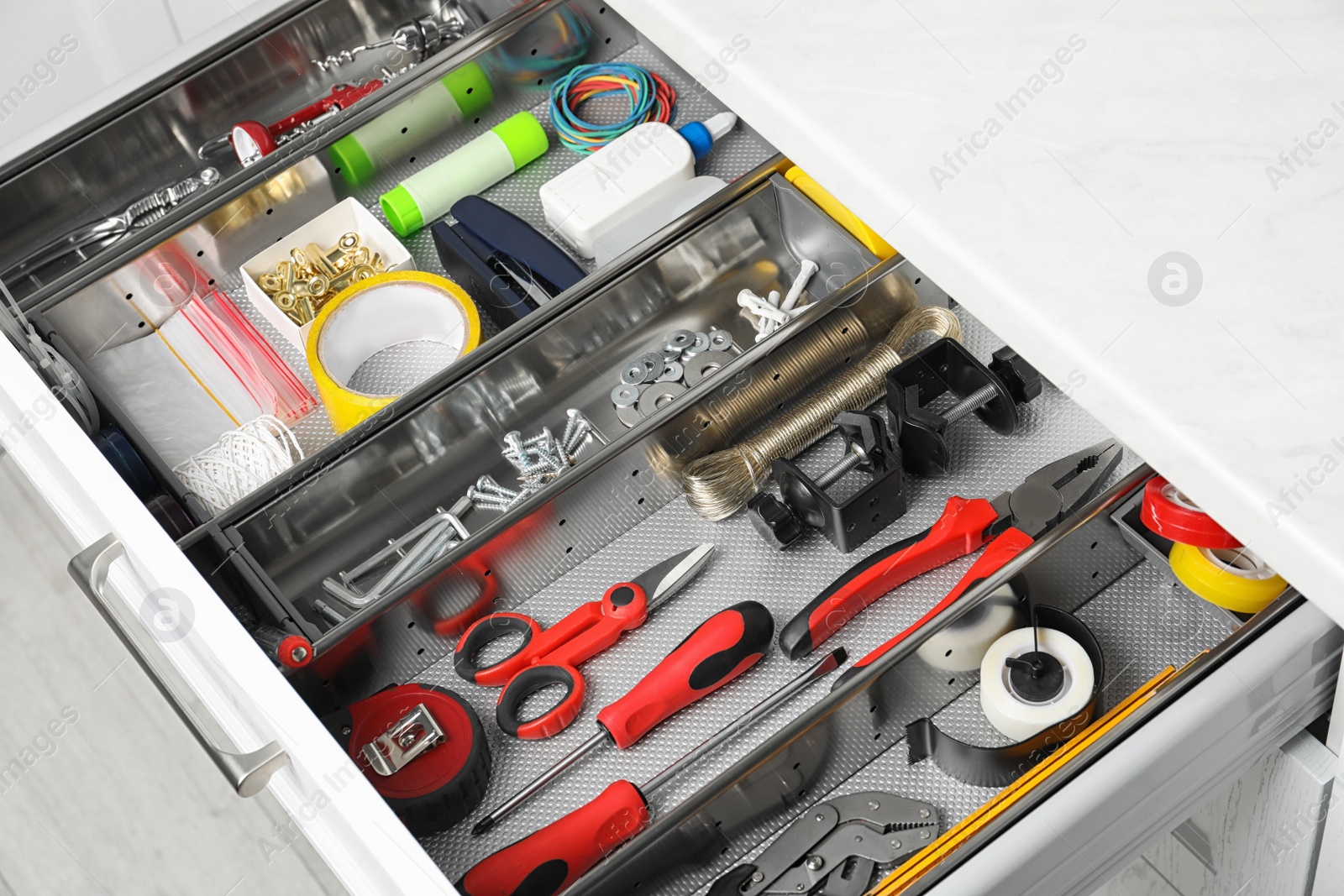 Photo of Set of instruments in open desk drawer indoors