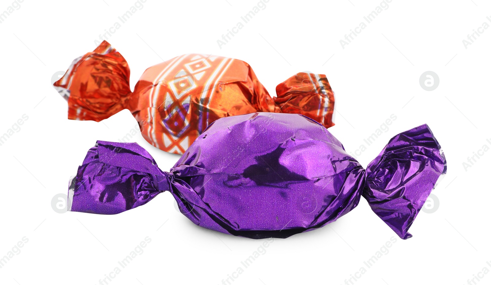 Photo of Sweet candies in colorful wrappers on white background