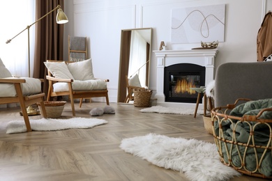 Photo of Beautiful living room interior with fireplace and armchairs