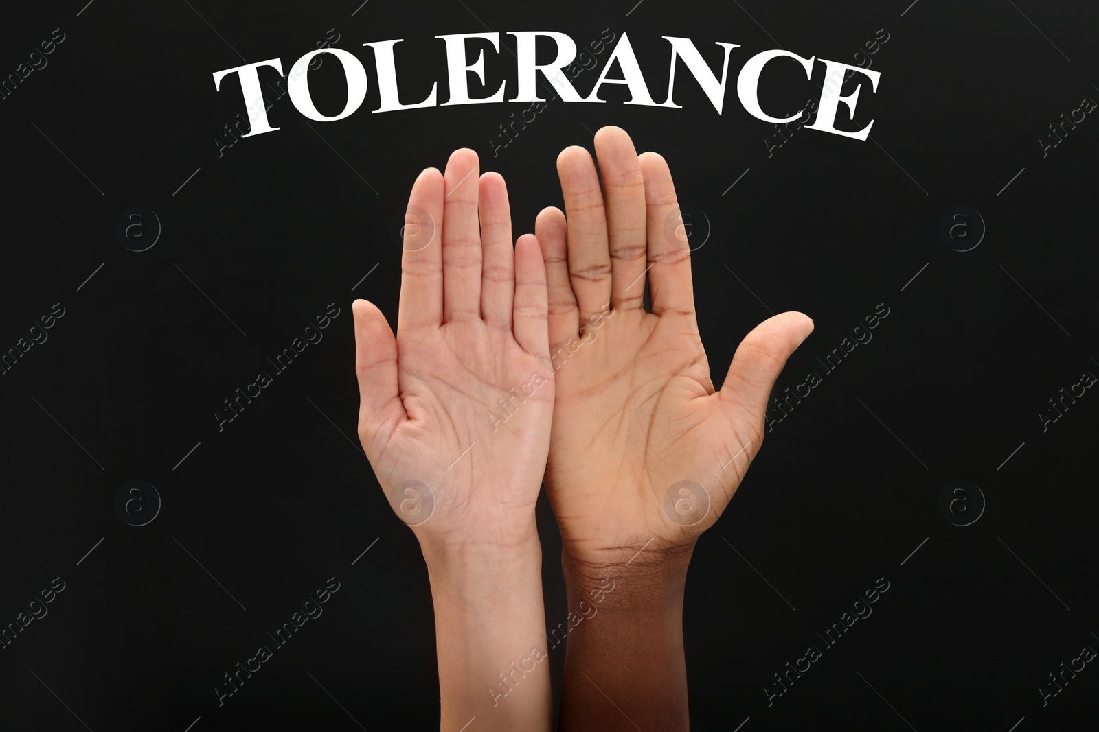 Image of Tolerance concept. Woman and man of different races showing hands on black background, closeup