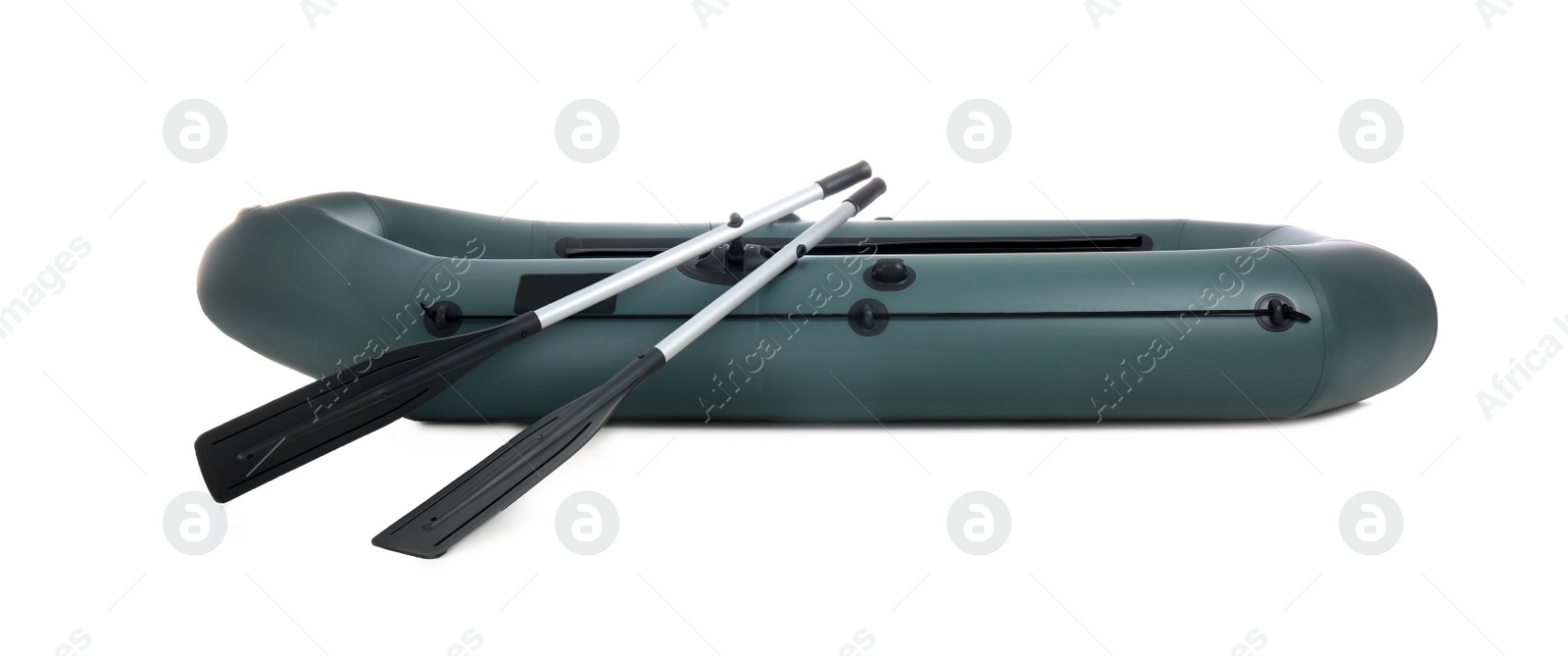 Photo of Inflatable rubber fishing boat with aluminium oars isolated on white