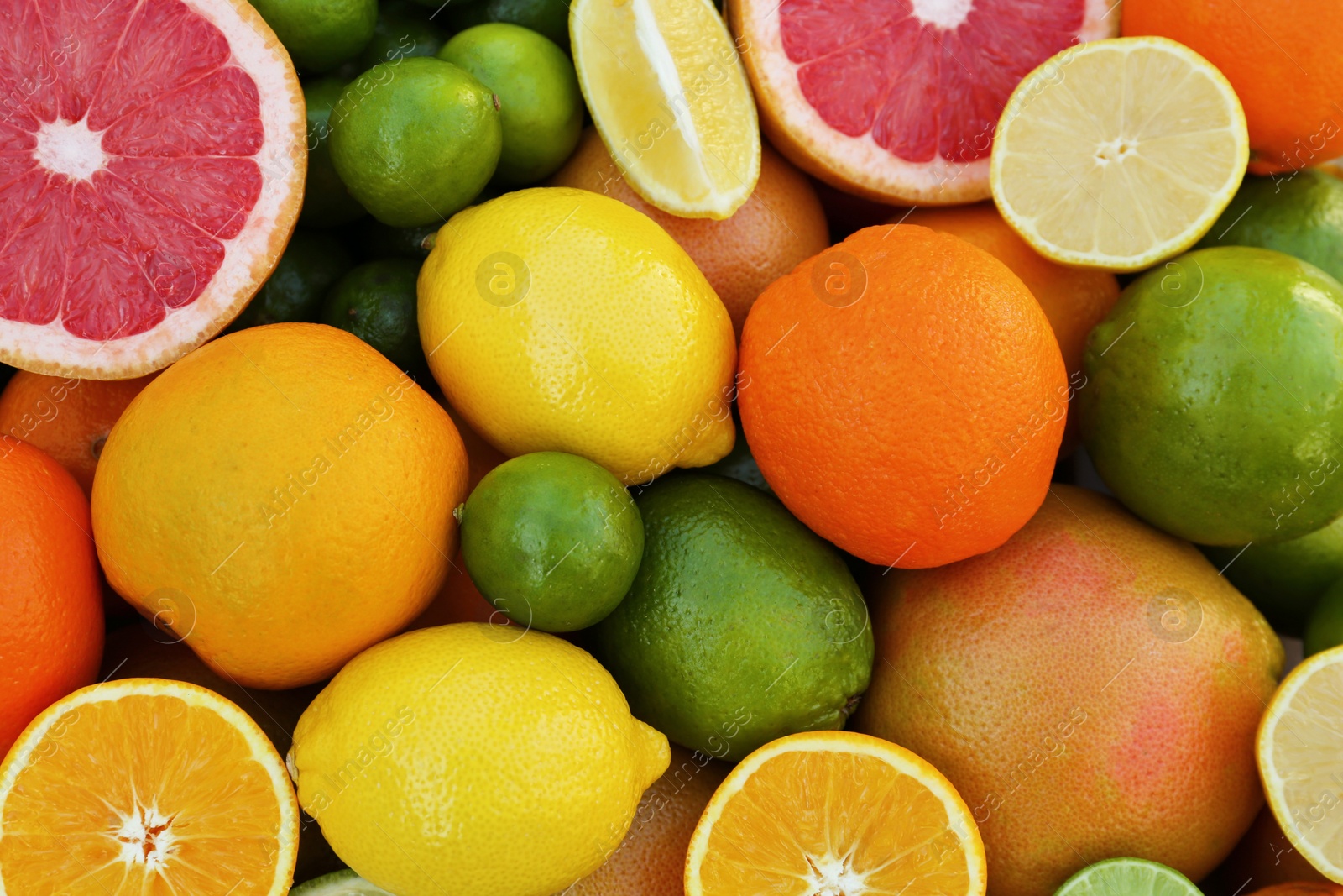 Photo of Different fresh citrus fruits as background, top view