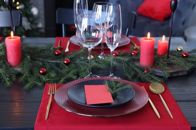 Photo of Elegant Christmas table setting with blank place card and festive decor