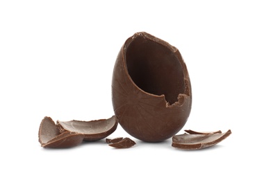 Photo of Broken milk chocolate egg on white background