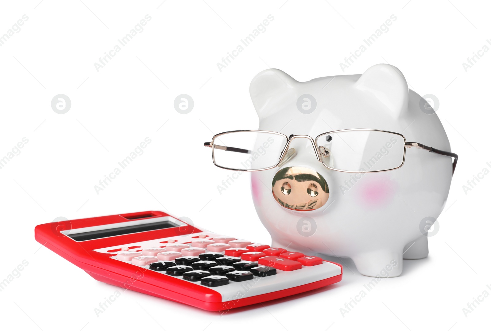 Photo of Piggy bank with glasses and calculator isolated on white