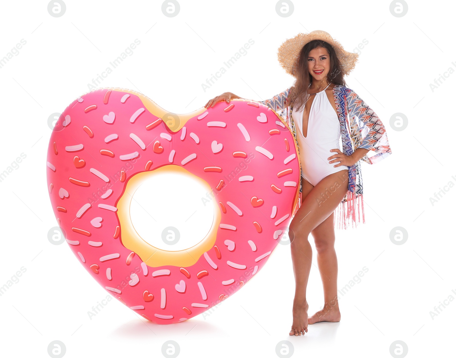 Photo of Beautiful young woman with inflatable heart on white background