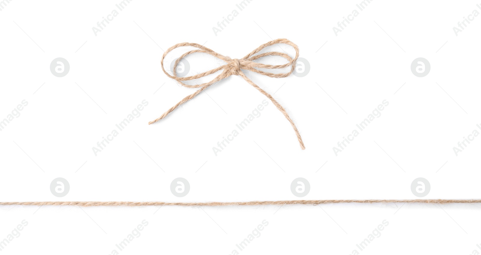 Photo of Linen rope string with bow isolated on white, top view