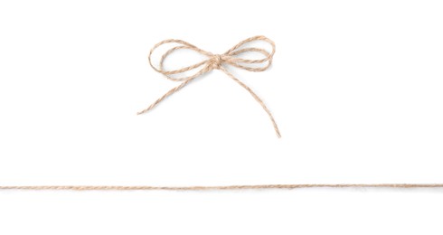 Linen rope string with bow isolated on white, top view