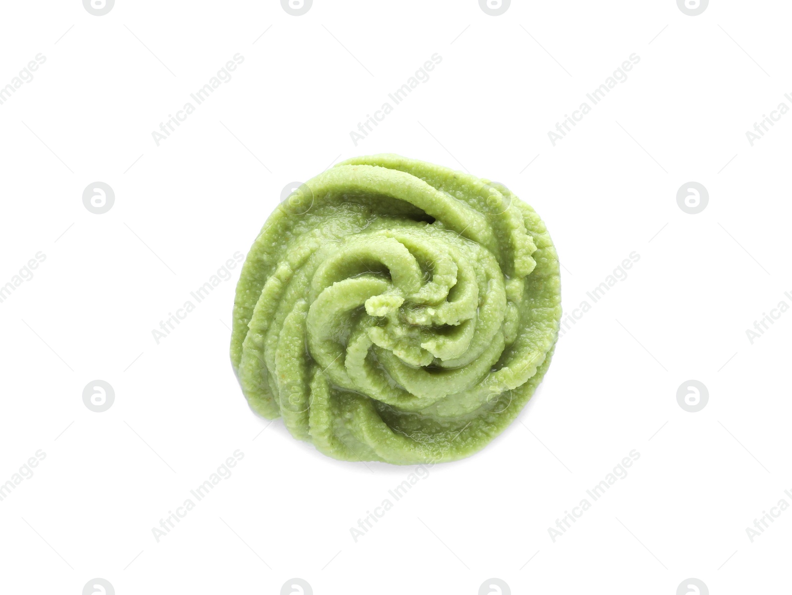 Photo of Swirl of delicious spicy wasabi paste isolated on white, top view