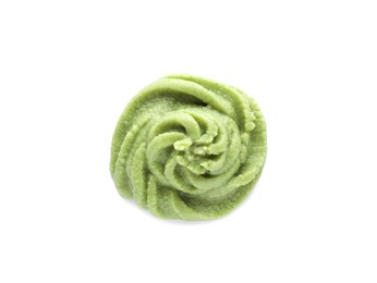 Photo of Swirl of delicious spicy wasabi paste isolated on white, top view