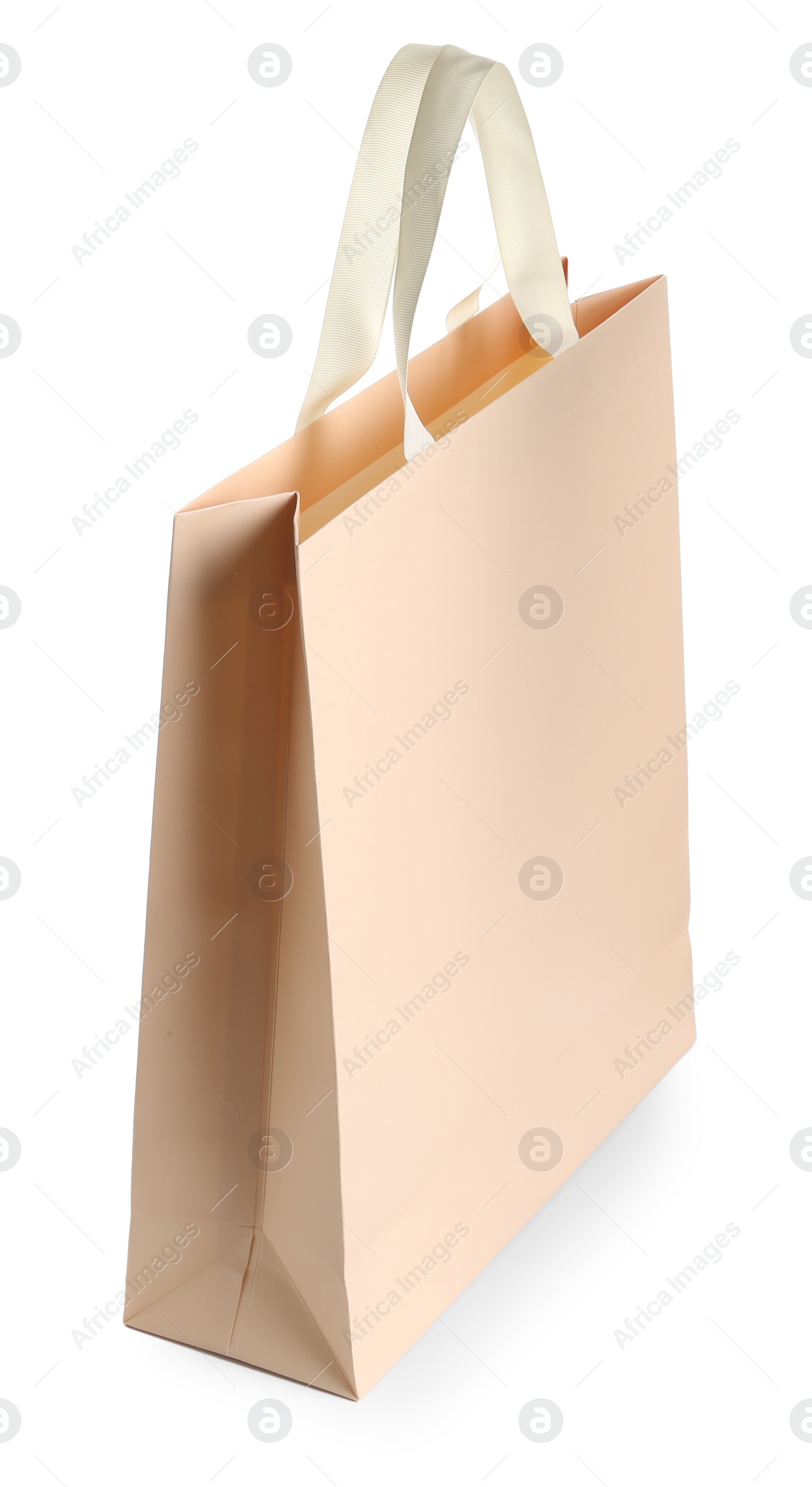 Photo of One paper bag isolated on white. Mockup for design