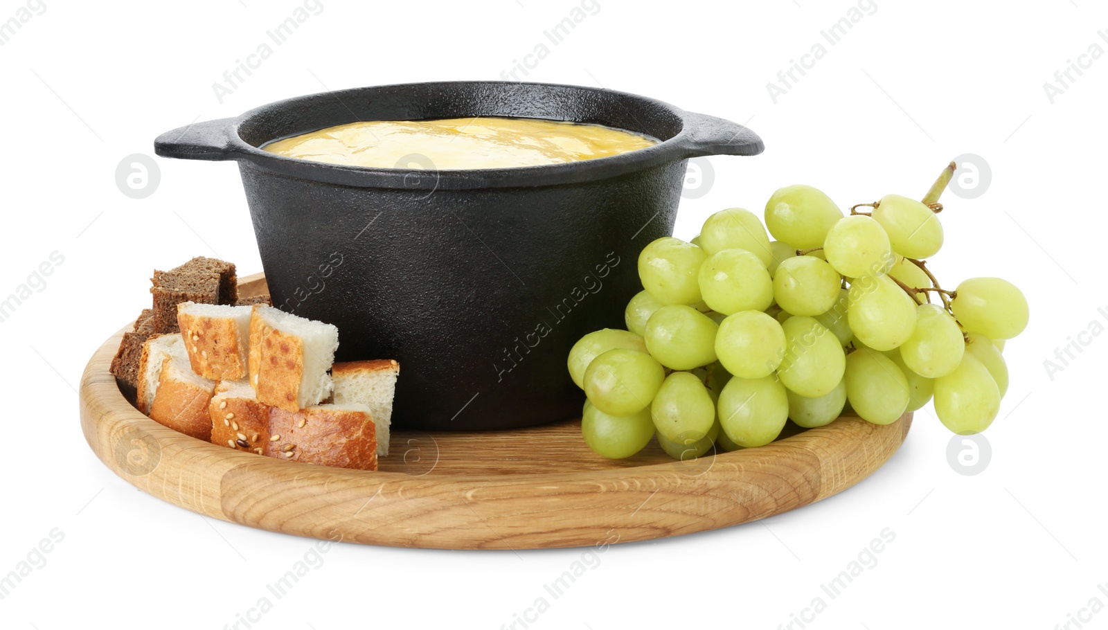 Photo of Fondue with tasty melted cheese and grapes isolated on white