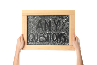 Woman holding blackboard with phrase ANY QUESTIONS on white background, closeup