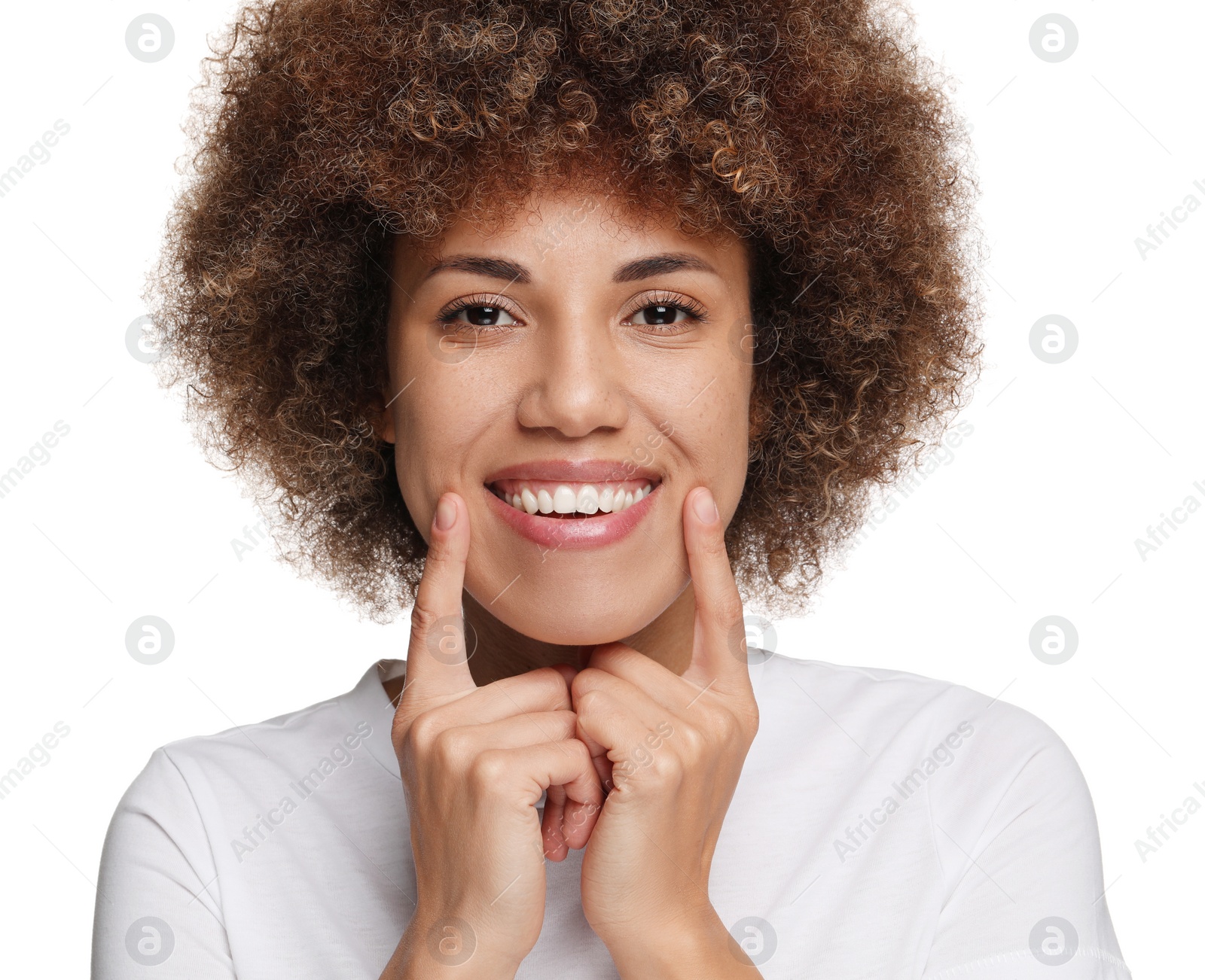 Photo of Woman showing her clean teeth and smiling on white background