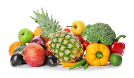 Rainbow collection of ripe fruits and vegetables on white background