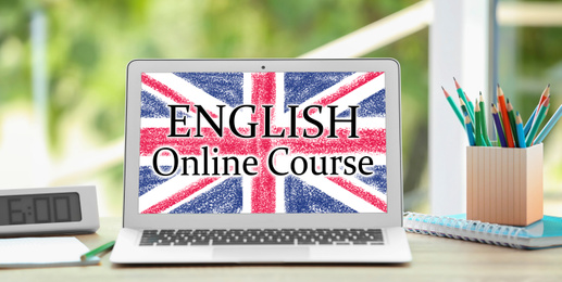 Image of Modern laptop for online English learning on table indoors