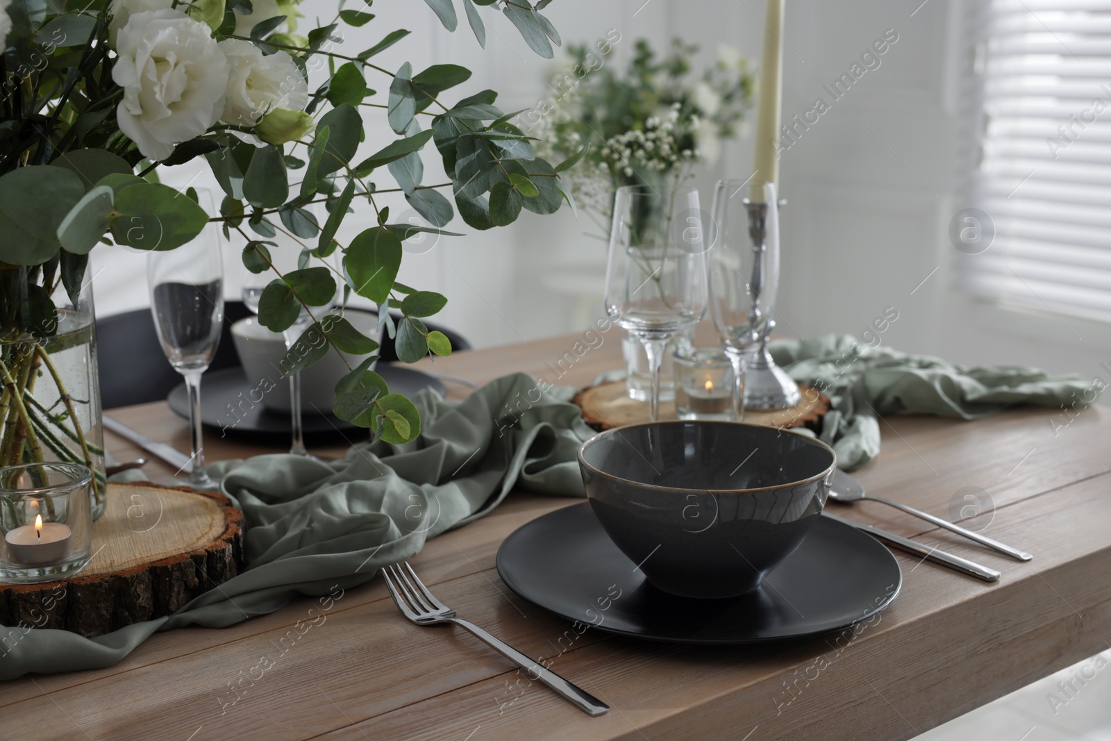 Photo of Festive table setting with beautiful tableware and decor indoors