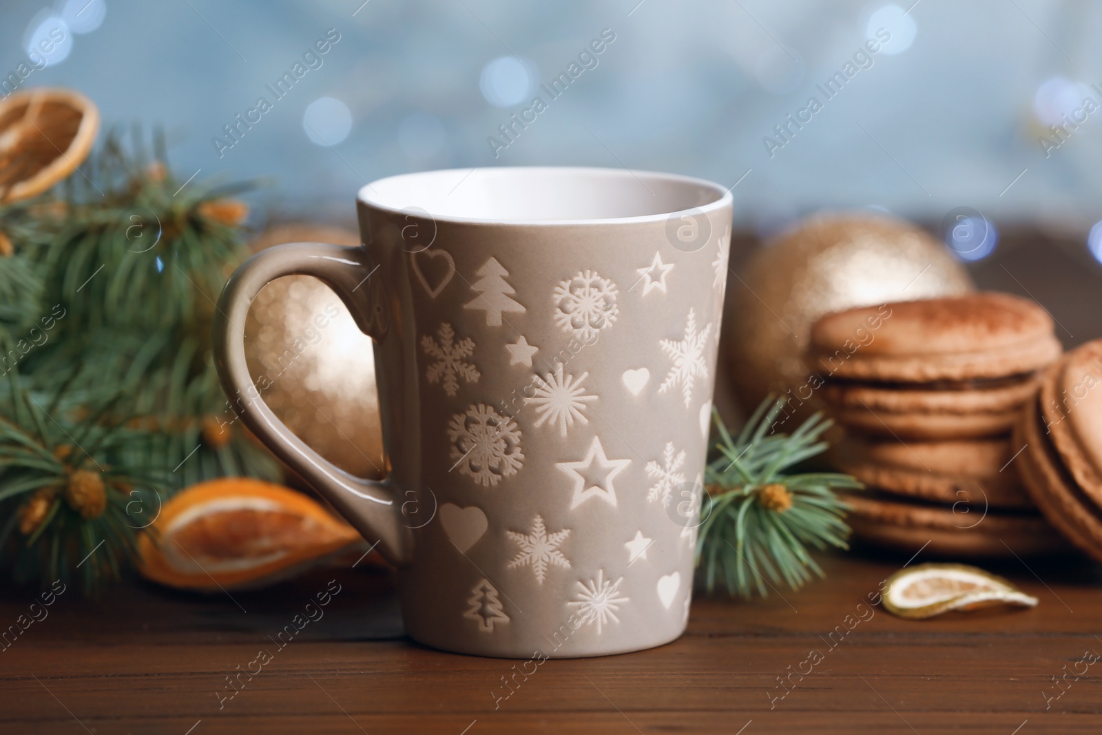 Photo of Cup with delicious hot cocoa drink on table