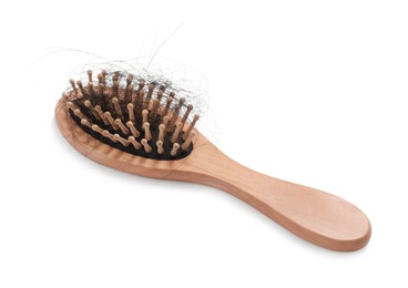 Photo of Wooden brush with lost hair on white background