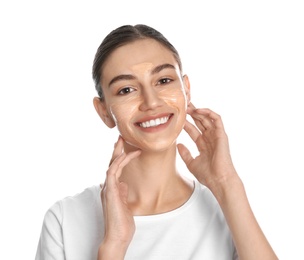 Photo of Happy young woman with organic mask on her face against white background