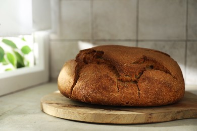 Photo of Freshly baked sourdough bread on light table