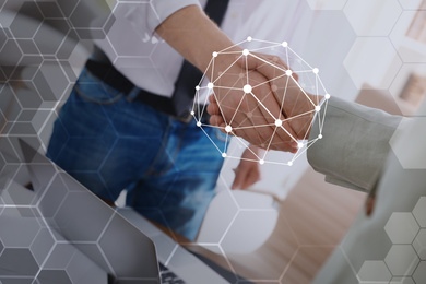 Image of Business people shaking hands and network connection lines, closeup. Modern technology