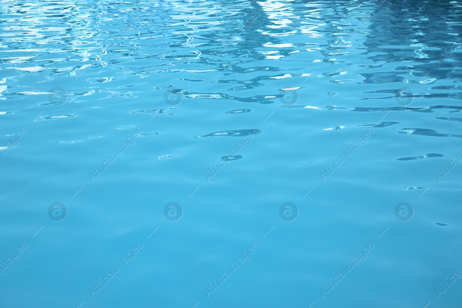 Photo of Clear water in swimming pool as background, closeup