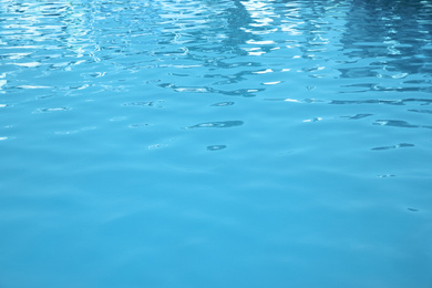 Photo of Clear water in swimming pool as background, closeup